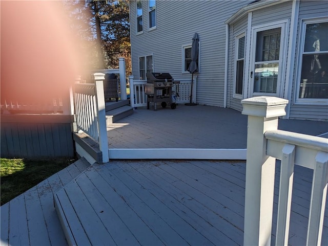 wooden deck with grilling area