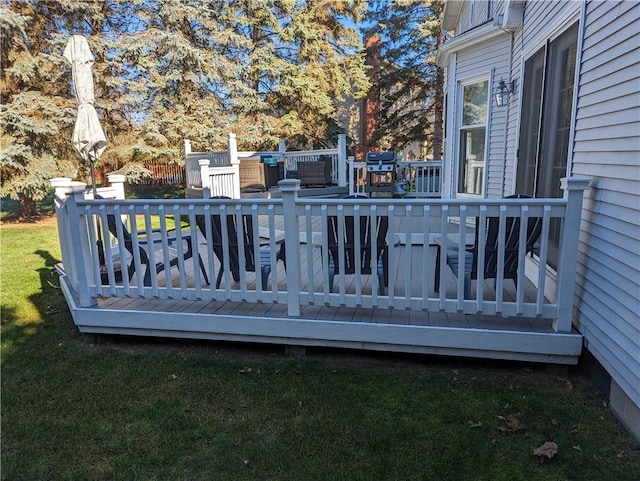 wooden deck with a yard