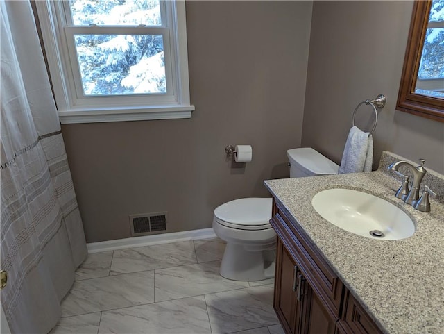 bathroom with vanity and toilet