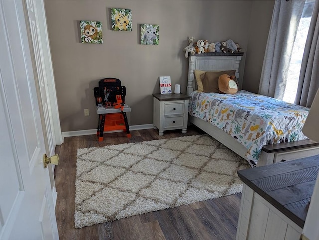 bedroom featuring dark wood-type flooring