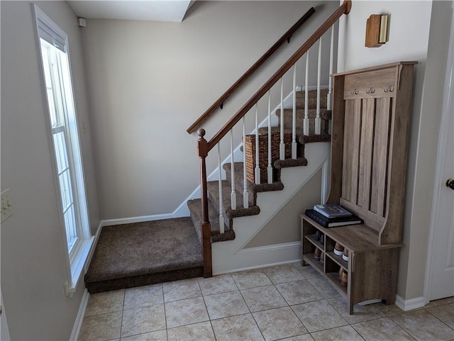 stairs with tile patterned flooring