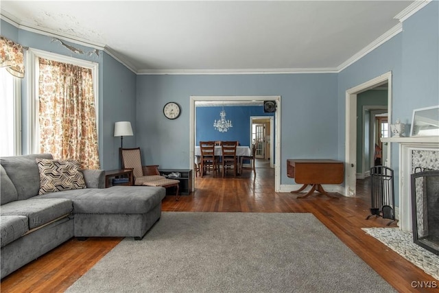 living room with dark wood-type flooring, crown molding, and a tile fireplace