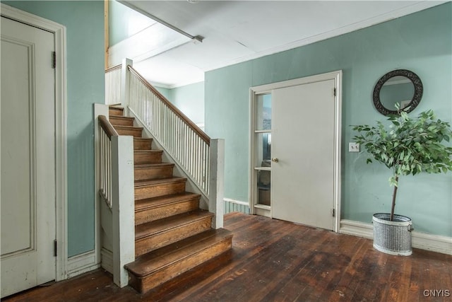 stairs featuring hardwood / wood-style flooring