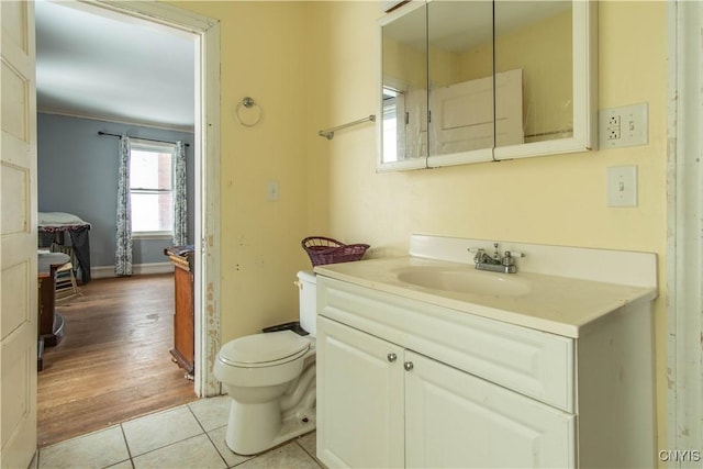 bathroom with tile patterned floors, toilet, and vanity