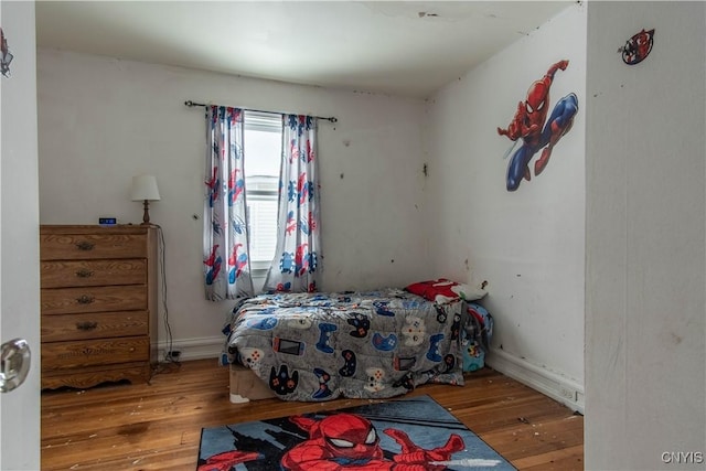 bedroom with wood-type flooring