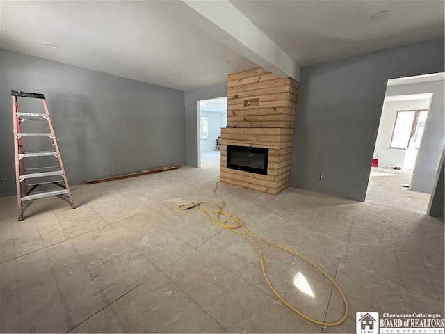 unfurnished living room featuring a fireplace