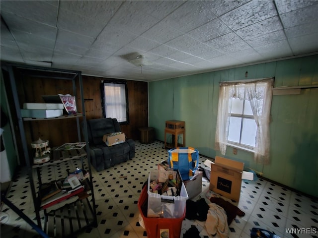 miscellaneous room featuring wooden walls