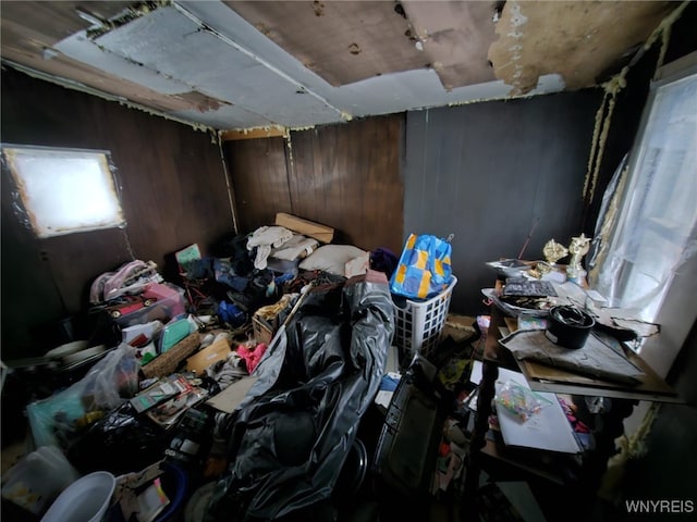 misc room featuring wooden walls