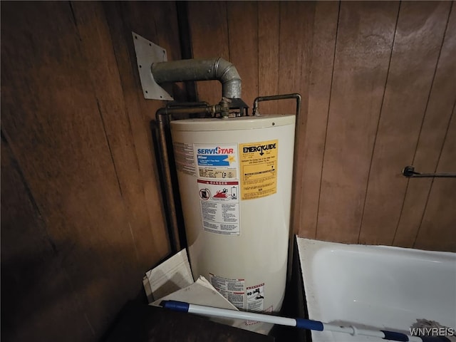 utility room with gas water heater