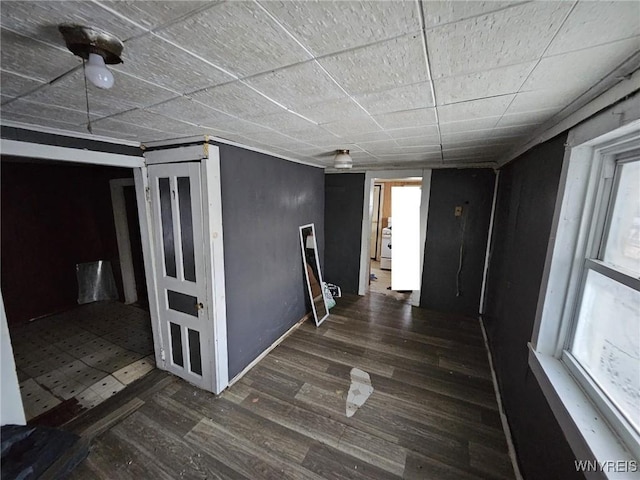 hallway with dark hardwood / wood-style floors