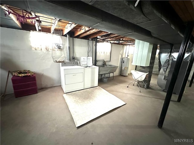 basement with washing machine and dryer, electric water heater, sink, and heating unit