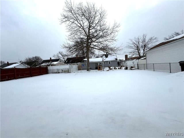 view of yard layered in snow