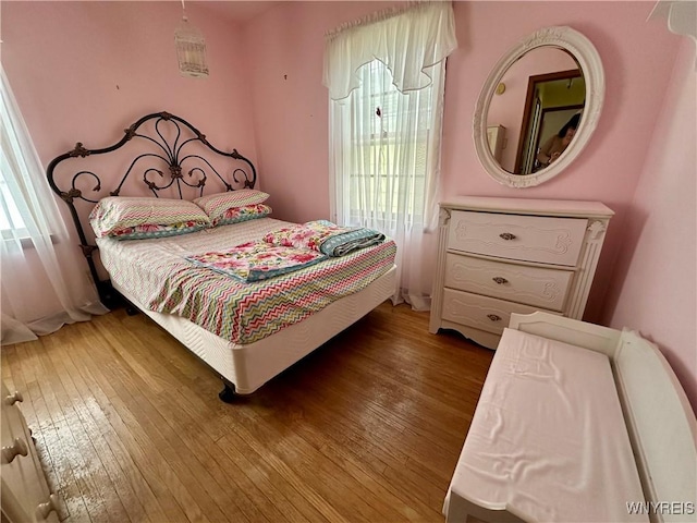 bedroom featuring wood-type flooring