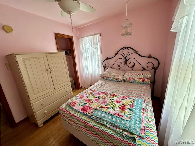 bedroom featuring hardwood / wood-style flooring and ceiling fan