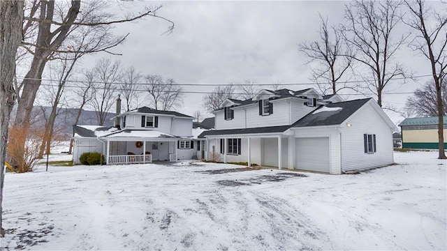 view of front of house with a garage and covered porch