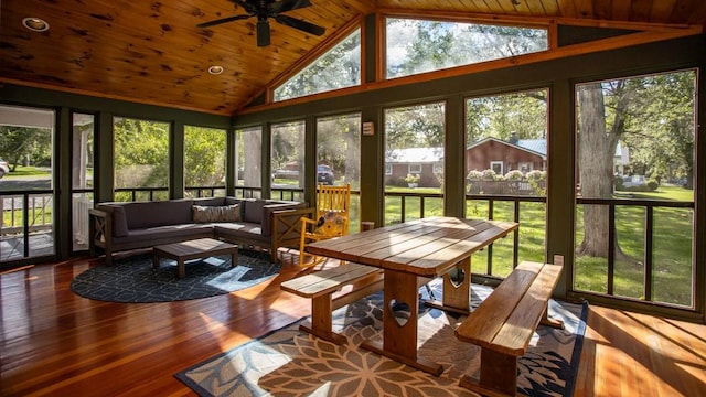 sunroom with ceiling fan, lofted ceiling, and wood ceiling