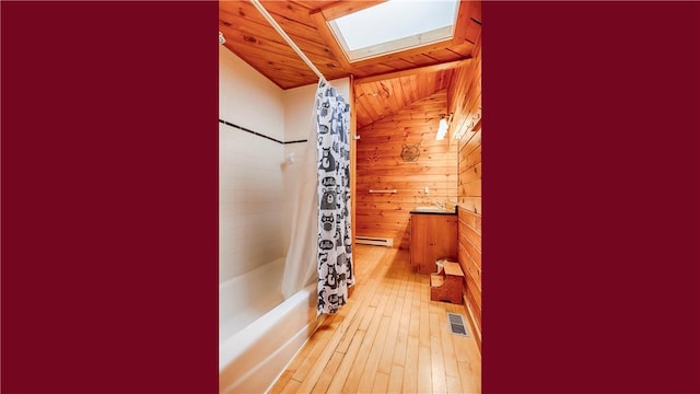 bathroom with wood ceiling, vanity, wooden walls, shower / bath combo, and hardwood / wood-style flooring