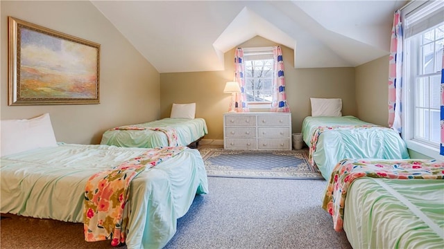 bedroom with vaulted ceiling and carpet flooring