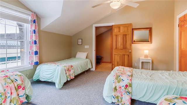 bedroom with lofted ceiling, carpet floors, and ceiling fan