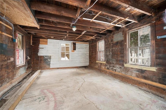 miscellaneous room featuring wood walls