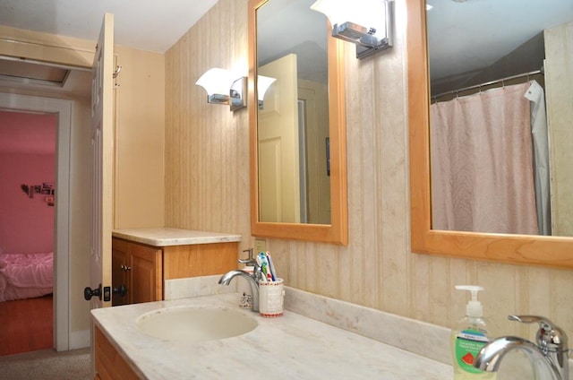 full bathroom with connected bathroom and vanity