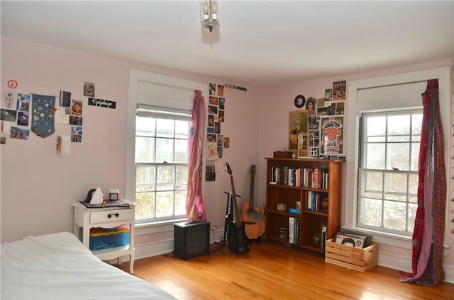 bedroom with wood finished floors