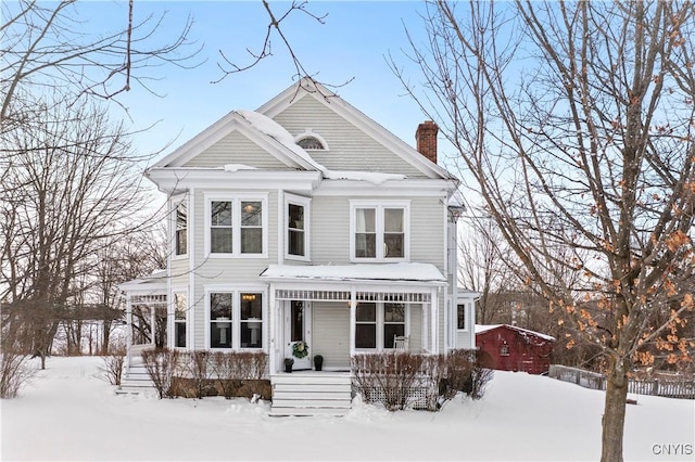 victorian-style house featuring a porch