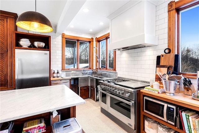 kitchen with premium range hood, decorative light fixtures, decorative backsplash, stainless steel appliances, and beam ceiling