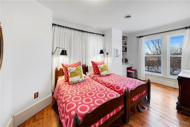 bedroom with hardwood / wood-style floors