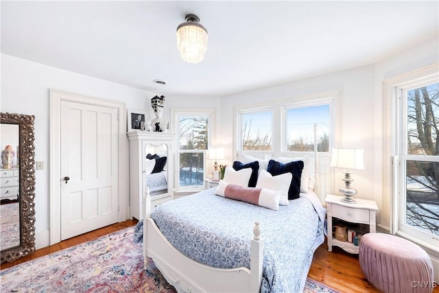 bedroom with hardwood / wood-style floors