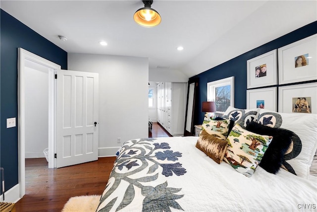 bedroom with dark hardwood / wood-style flooring