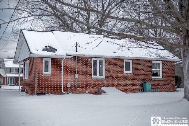 view of snow covered house