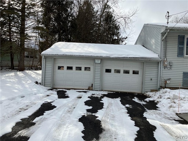 view of snow covered garage