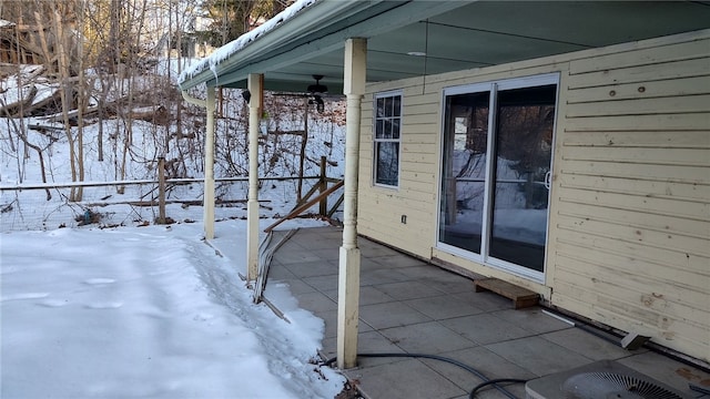 exterior space featuring ceiling fan