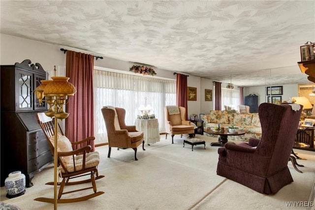 carpeted living room with a textured ceiling