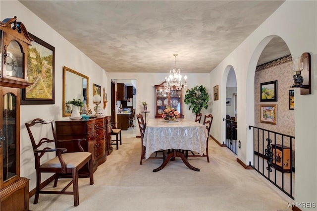 dining space featuring a notable chandelier