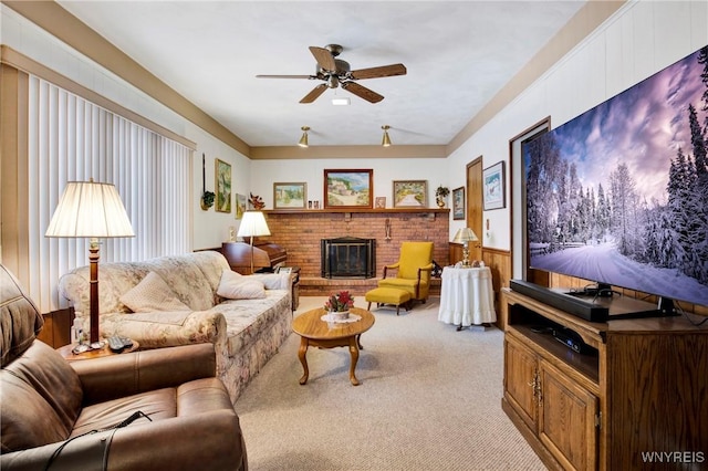 carpeted living room featuring ceiling fan and a fireplace