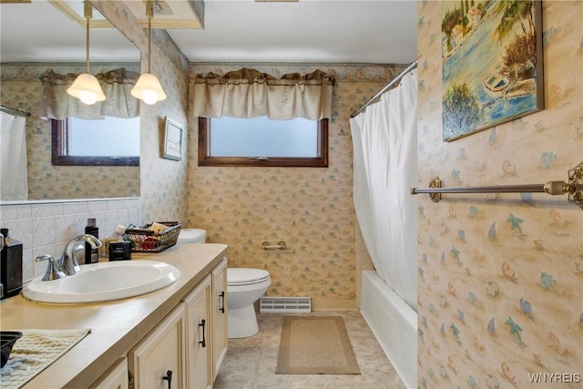 full bathroom featuring vanity, toilet, and shower / tub combo with curtain