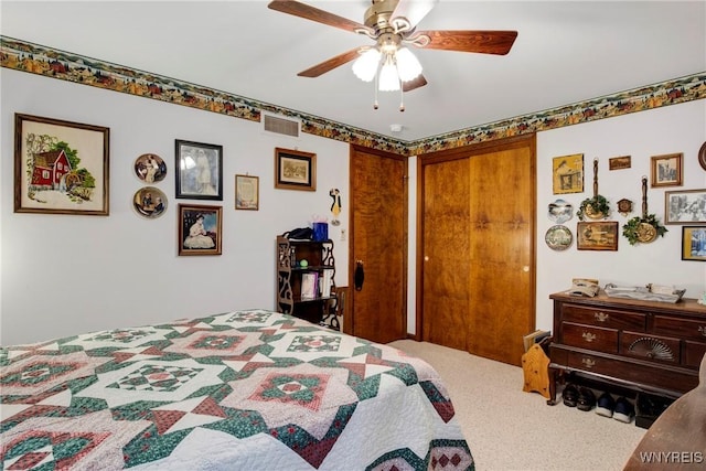 bedroom with ceiling fan and carpet floors