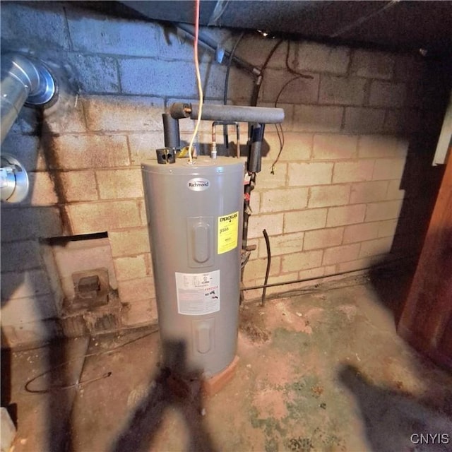 utility room featuring water heater