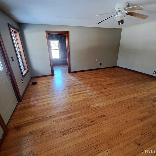 spare room with light hardwood / wood-style floors and ceiling fan