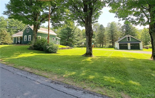 view of yard with an outbuilding and a garage