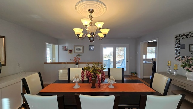 dining space with a notable chandelier