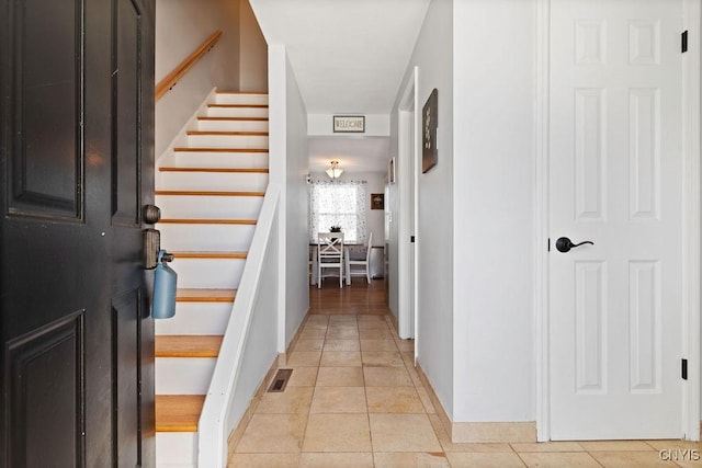 view of tiled foyer entrance