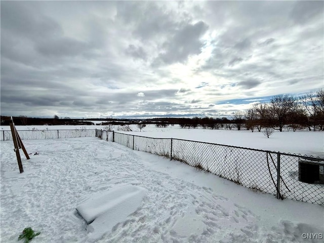 view of yard layered in snow