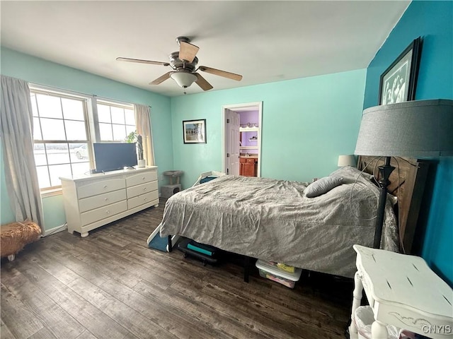 bedroom featuring ceiling fan, ensuite bathroom, and dark hardwood / wood-style floors