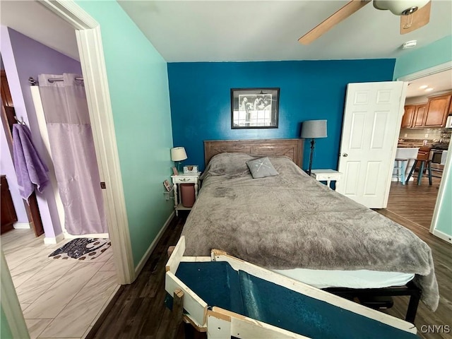 bedroom featuring dark wood-type flooring and ceiling fan