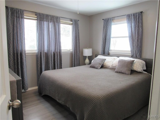 bedroom with light wood-type flooring