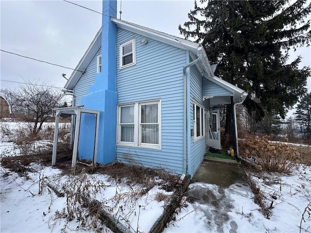 view of snow covered property