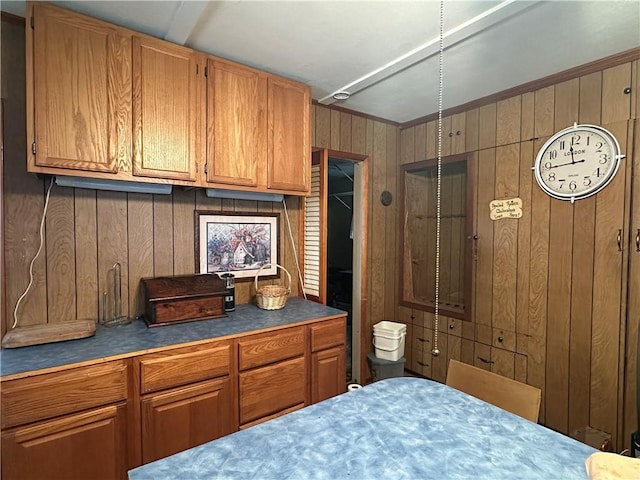 bedroom featuring wooden walls